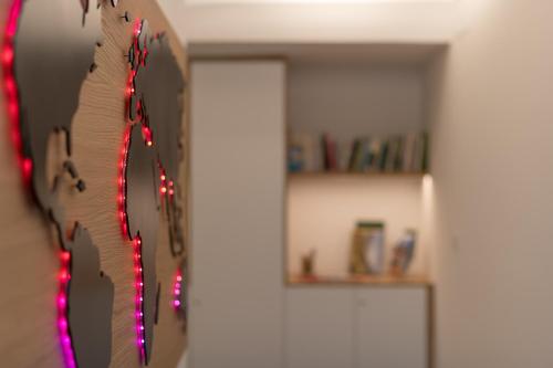 a clock on a wall with christmas lights on it at Haus Piger in Termeno