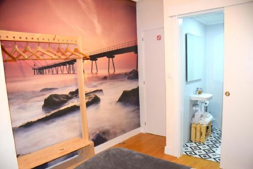 a bedroom with a wall mural of a pier at Maite Urban Dreams in Barakaldo