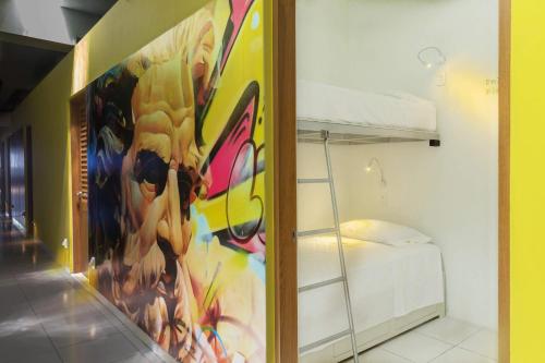 Postel nebo postele na pokoji v ubytování Hostel Frente al Mar Tropico 20º