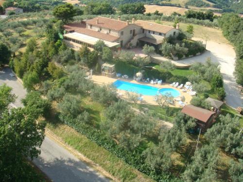 an aerial view of a house with a swimming pool at Agriturismo La Casella in San Terenziano