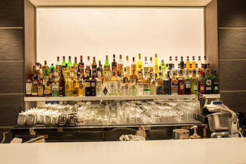 a bar filled with lots of bottles and glasses at Hotel Imperial in San Benedetto del Tronto