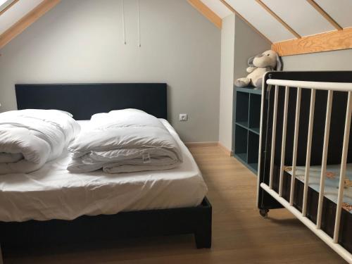 Кровать или кровати в номере Beachhouse Wenduine 25