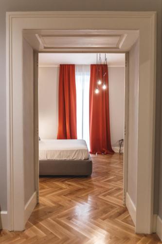 a bedroom with a bed and a window at Relais Della Porta in Naples