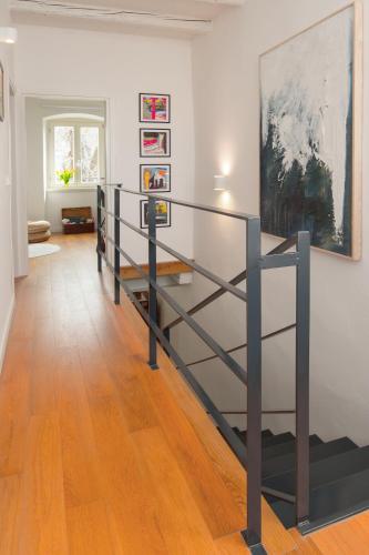 a staircase in a room with a painting on the wall at Casa Bel Olivo in Vodnjan