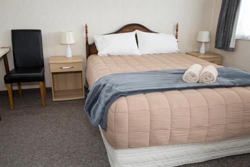 Ένα ή περισσότερα κρεβάτια σε δωμάτιο στο Greymouth Motel