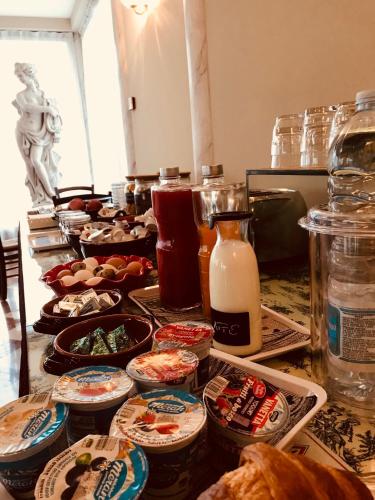 a table with many dishes of food and milk at Hotel Al Sole in Preganziol
