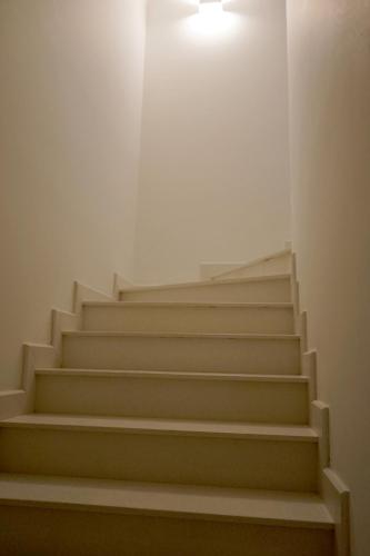 a set of stairs with a light on the top at La Cigale Residence in Ho Chi Minh City