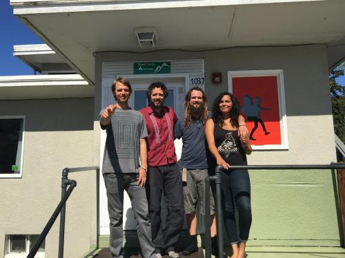 a group of people standing in front of a building at Base Camp Anchorage Hostel in Anchorage