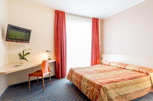 Postel nebo postele na pokoji v ubytování Hotel San Vito