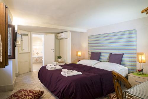 A bed or beds in a room at RossoCorallo B&B