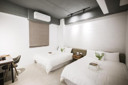 Ein Bett oder Betten in einem Zimmer der Unterkunft Tiin Tinn - Rivershore B&B