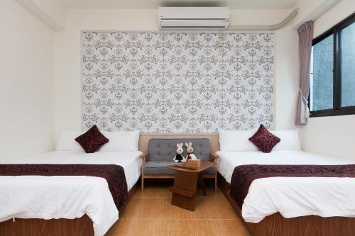 Postel nebo postele na pokoji v ubytování Four Seasons Homestay