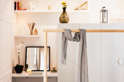 a dressing room with a mirror and a dressing table at Stay In Ortigia in Siracusa