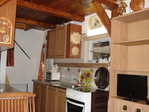 a kitchen with a sink and a stove top oven at chatka in Rajecké Teplice