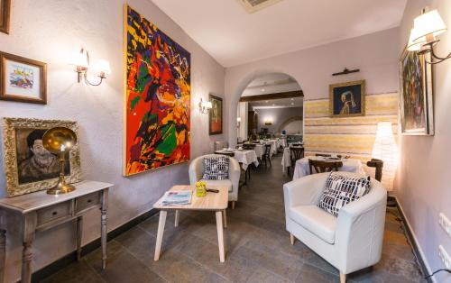 Ein Sitzbereich in der Unterkunft Hotel Alda Vía León