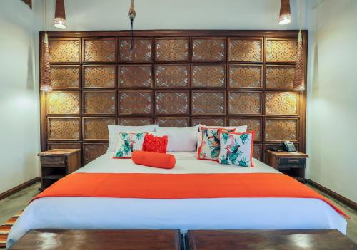 Ένα ή περισσότερα κρεβάτια σε δωμάτιο στο Hotel Casa San Carlos Lodge Pereira