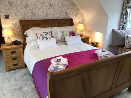 Rúm í herbergi á Lon y Traeth Bed & Breakfast