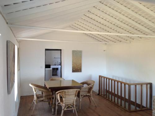 a dining room with a table and chairs at Casa do Alto in Santana