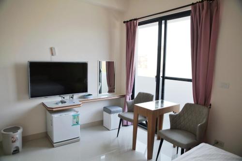 TV a/nebo společenská místnost v ubytování Caibei Homestay