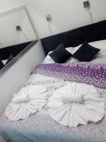 Postel nebo postele na pokoji v ubytování Apartment Centar