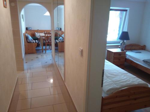 a room with a door leading to a bedroom at Teltow Ferienwohnung in Teltow