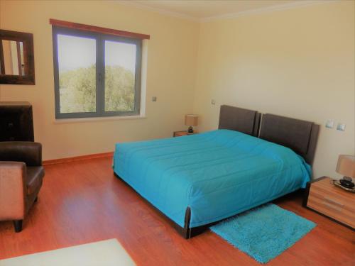 En eller flere senge i et værelse på Quinta Sabaudia