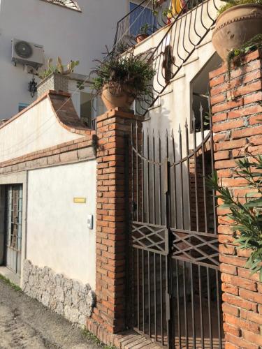 a gate to a house with plants on it at Sciala' in Taormina