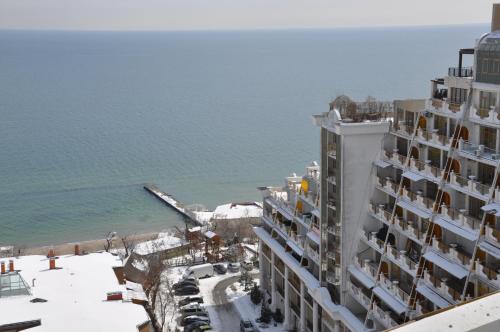 an aerial view of a building next to the ocean at Arcadia Palace Apartments with Sea View in Odesa