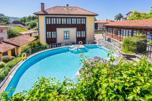 Πισίνα στο ή κοντά στο Apartamentos La Casona De Vidiago