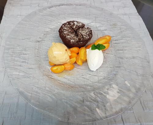 a plate with a doughnut and vegetables on a table at Gasthof Liederhalle in Aalen