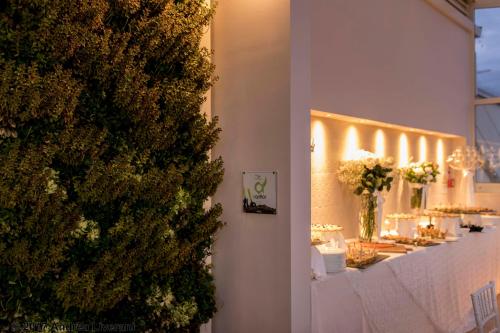 a dining room with a christmas tree on the wall at Hotel Donatello Imola in Imola