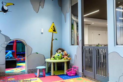 a room with a table with toys on it at Hotel Donatello Imola in Imola