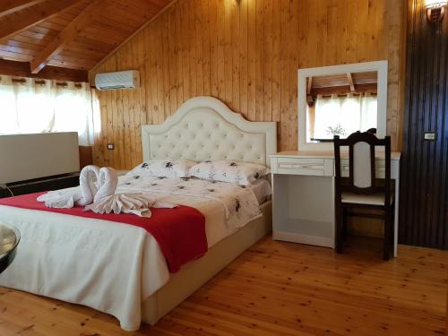 Postel nebo postele na pokoji v ubytování Hotel Vataksi