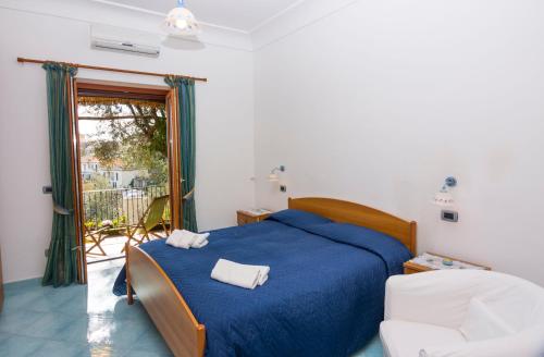 Postel nebo postele na pokoji v ubytování Le Nereidi B&B