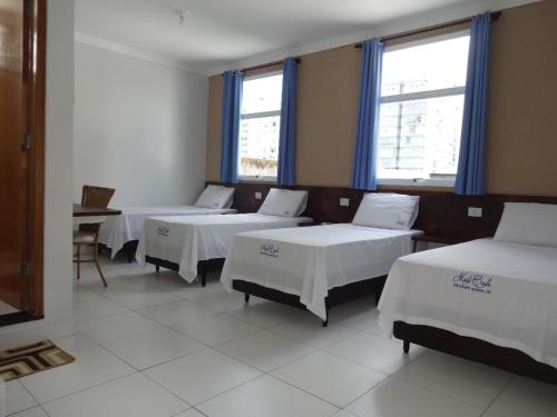 Ένα ή περισσότερα κρεβάτια σε δωμάτιο στο Hotel Monte Carlo Uberlândia