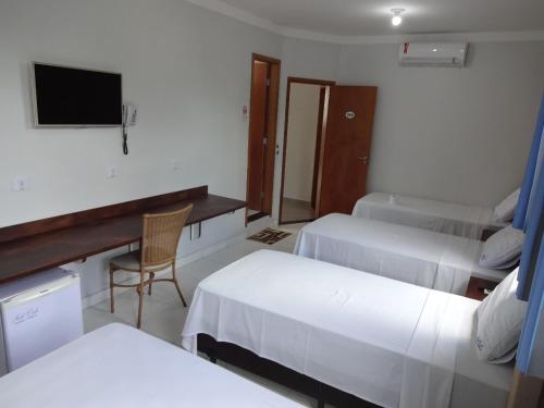 Ένα ή περισσότερα κρεβάτια σε δωμάτιο στο Hotel Monte Carlo Uberlândia