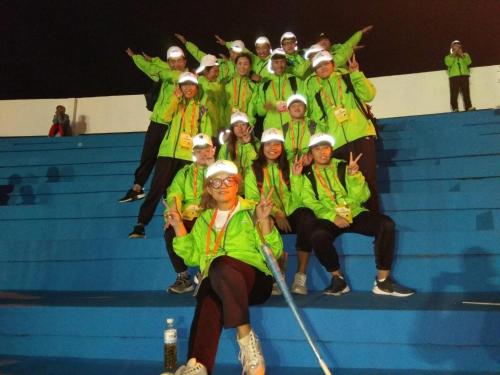 a group of people in yellow jackets posing for a picture at Art Taiwan Homestay in Shunan