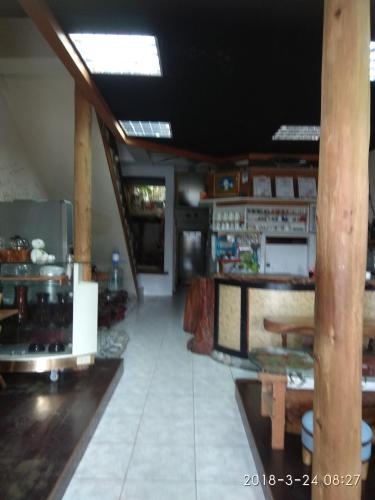 a large room with a kitchen and a table at Art Taiwan Homestay in Shunan