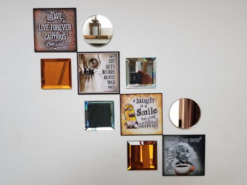 a collage of pictures on a wall at Atlantic Loft - Open plan apartment with Sea Views in Melkbosstrand
