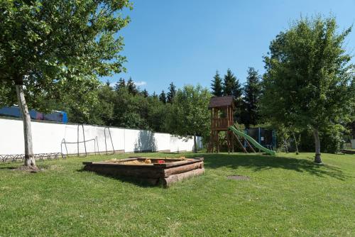a park with a playground with a play structure at Penzion Fojtstvi in Olomouc