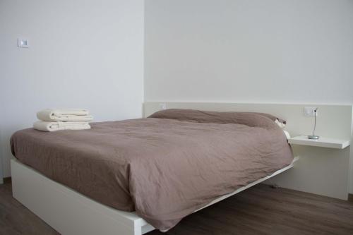 Una cama o camas en una habitación de Ingrappa Sporthouse
