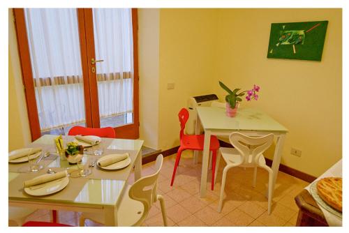 a dining room with a table and chairs and a table and chairsktop at Agriturismo Monte Cologna in Foligno