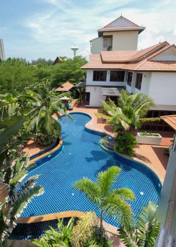 an overhead view of a swimming pool in front of a house at The Orchid Beach Resort @ VIP Chain Resort in Ban Phe
