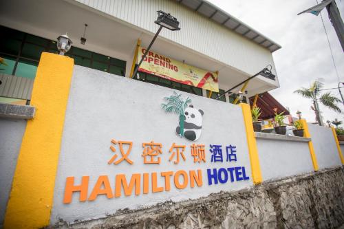 a sign for a hamilton hotel in front of a building at Hamilton Hotel Kajang in Kajang