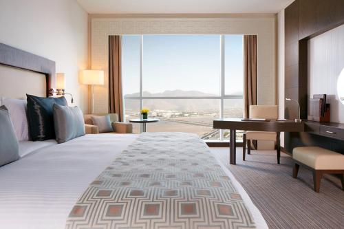 Ένα ή περισσότερα κρεβάτια σε δωμάτιο στο Royal M Hotel Fujairah by Gewan