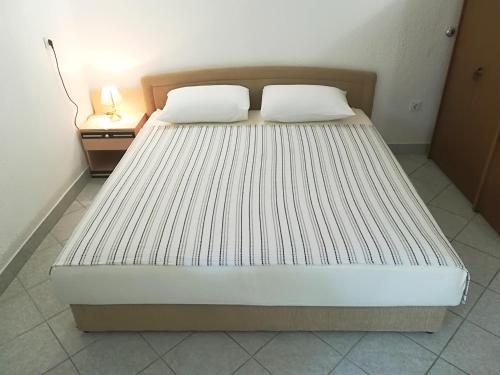 Apartment and Rooms Markovicにあるベッド