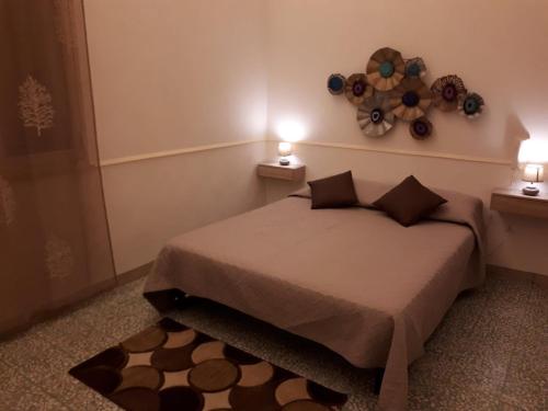 سرير أو أسرّة في غرفة في Casa vacanze Giulia