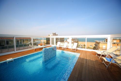 a large swimming pool on top of a building at Hotel Panama Majestic in Rimini