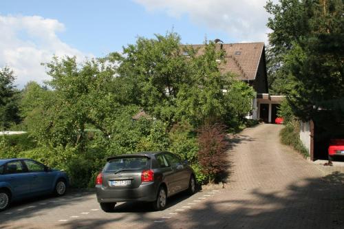 a car parked in front of a house at Haus Fernblick in Bad Grund