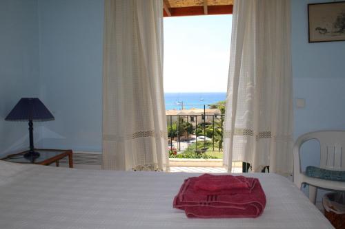 A bed or beds in a room at Pasha Bay Residence